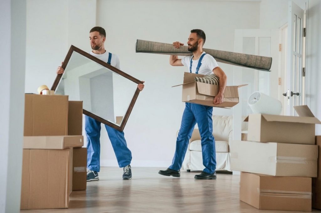 Back Savers moving crew carefully unloading a rental truck outside an apartment building in Portland, Oregon